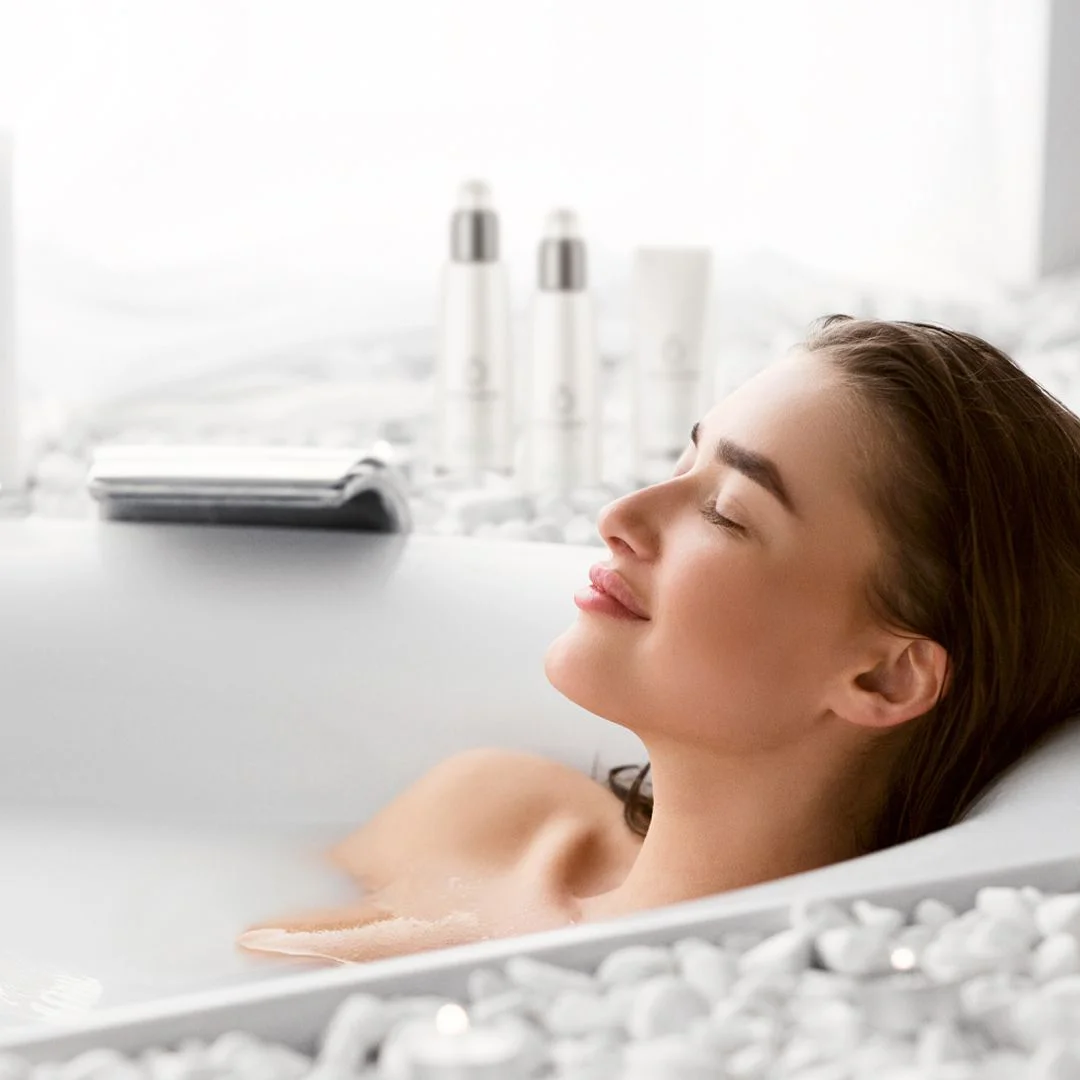 Woman relaxing in a hydromassage bath during a detox and hydromassage VIP package in Las Vegas